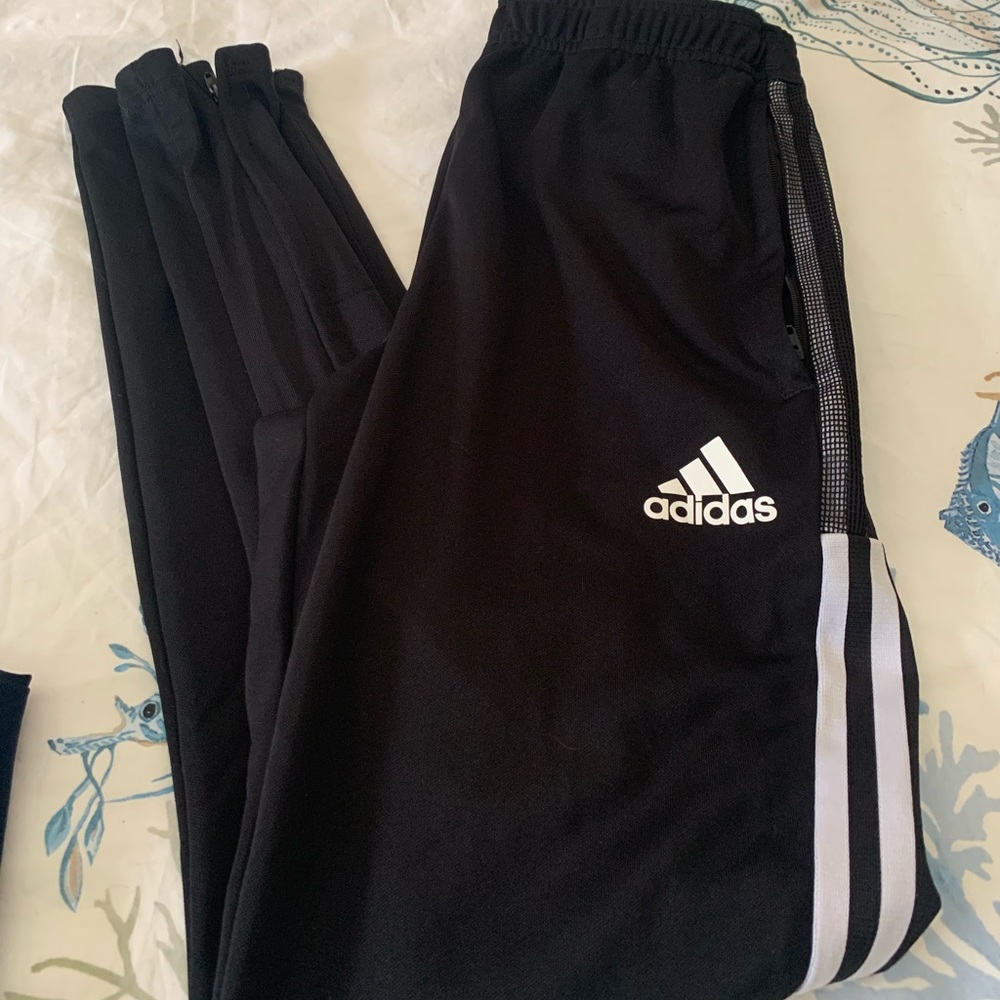 Adidas black track pants men size small. Gently used. Zippered at ankle